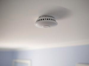 smoke alarm on a wall.