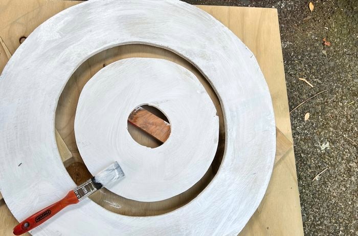 Two circle plywood frames painted white