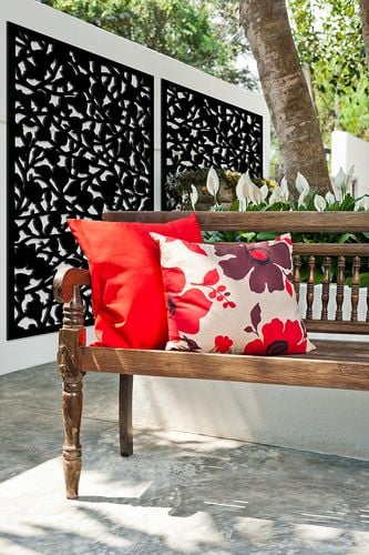 Outdoor timber bench with decorative wall screen
