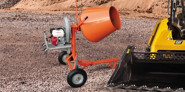 cement mixer and digger on construction site
