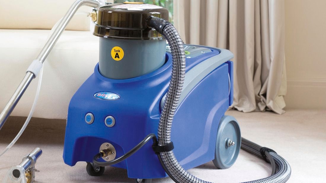 Britex carpet cleaner and a couch