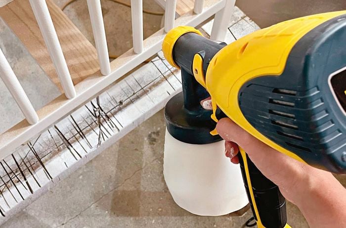 Hand painting cot flipped upside down spray gun