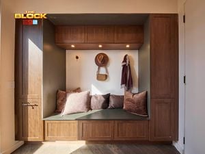 Mudroom nook from The Block with timber cabinetry, built-in bench, cushions, and wall hooks.