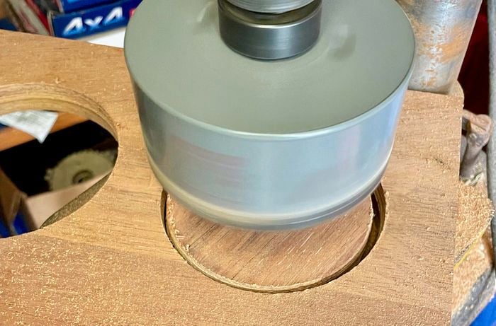 Birds-eye view shot of a circular groove mad in a plank of wood
