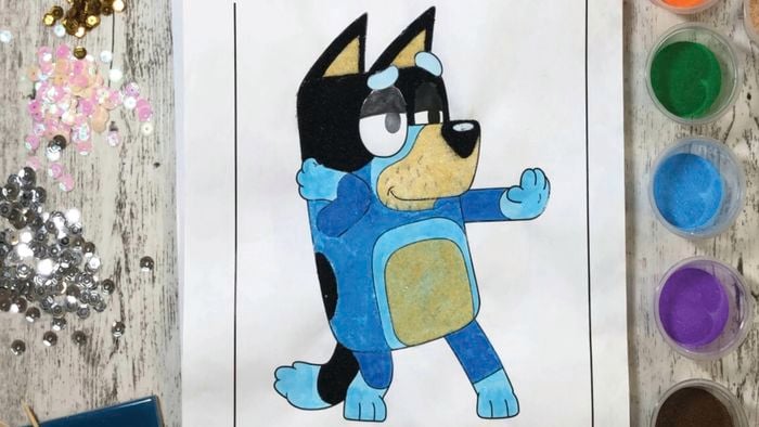 DIY Colouring page of Bluey surrounded by coloured sand