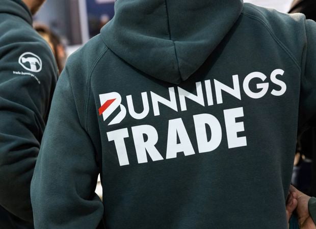 Three tradies wearing our trade bunnings hoodies