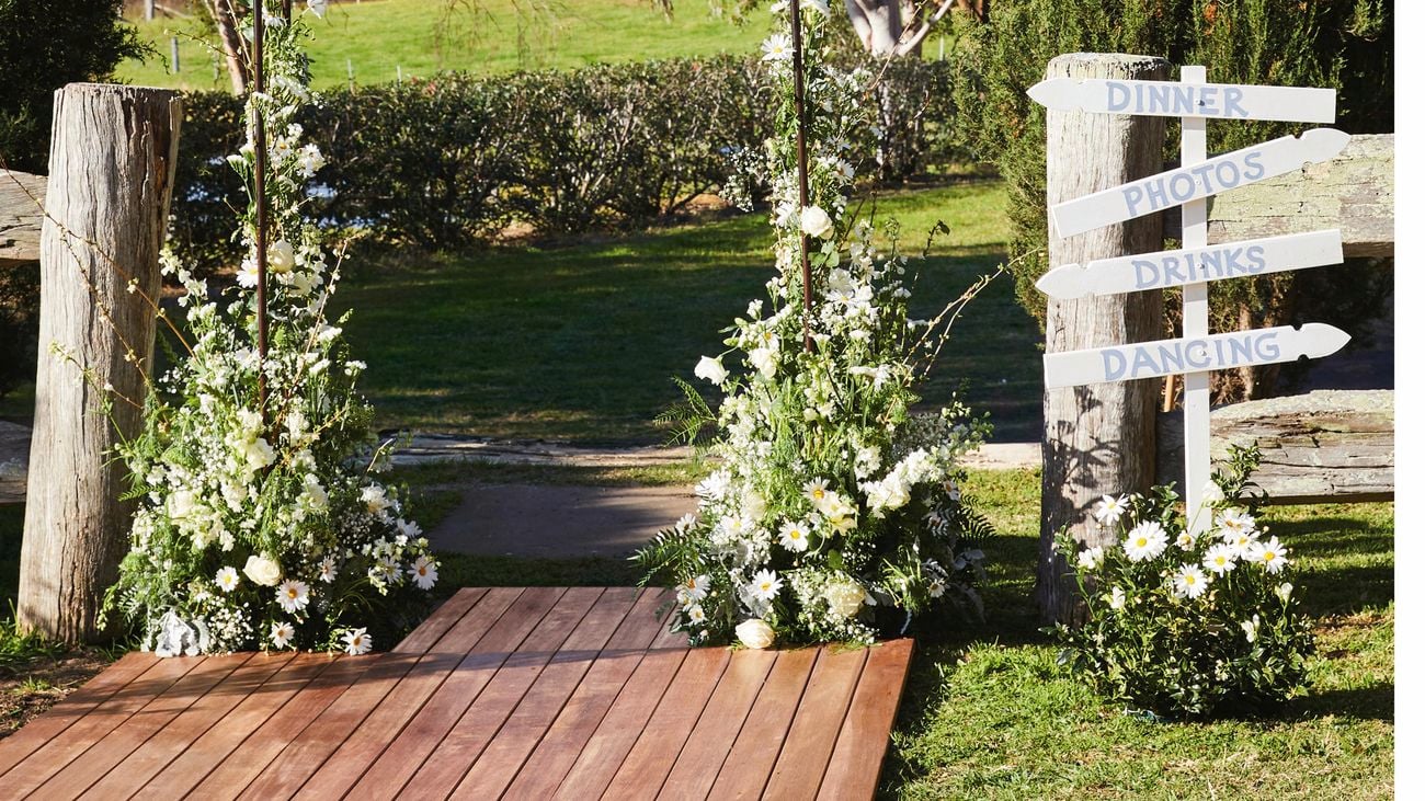 A stunning floral arch and modular decking  aisle and altar to replicate the aisle and altar.