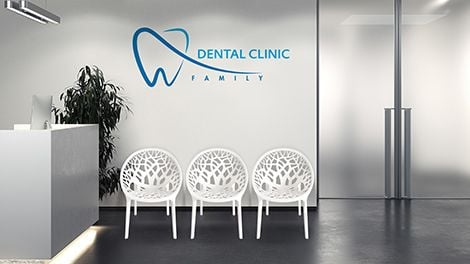 Waiting area in a dental clinic with three moulded outdoor-style chairs