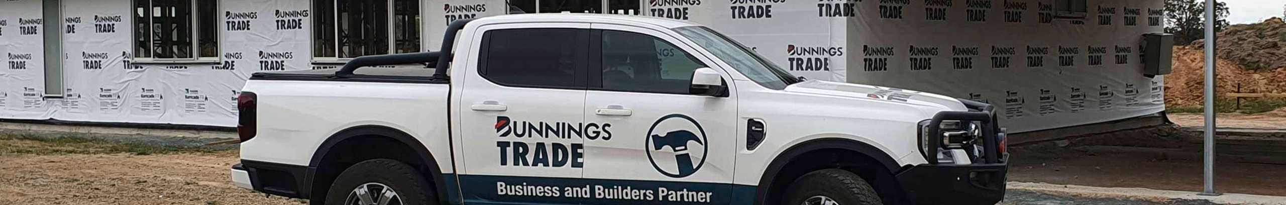 Bunnings Trade Ute parked at the front of a jobsite.