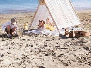 Two kids enjoying a finished beach tent in situ