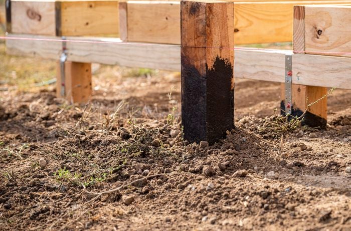 Stump hole with a stump having been backfilled with soil