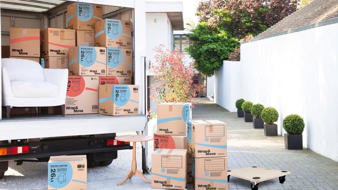 Removal truck full of packing boxes and furniture