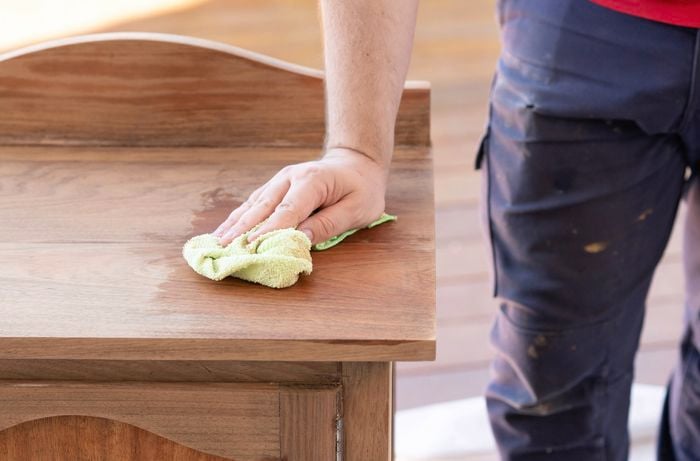 Wipe the surface with a cloth after sanding 