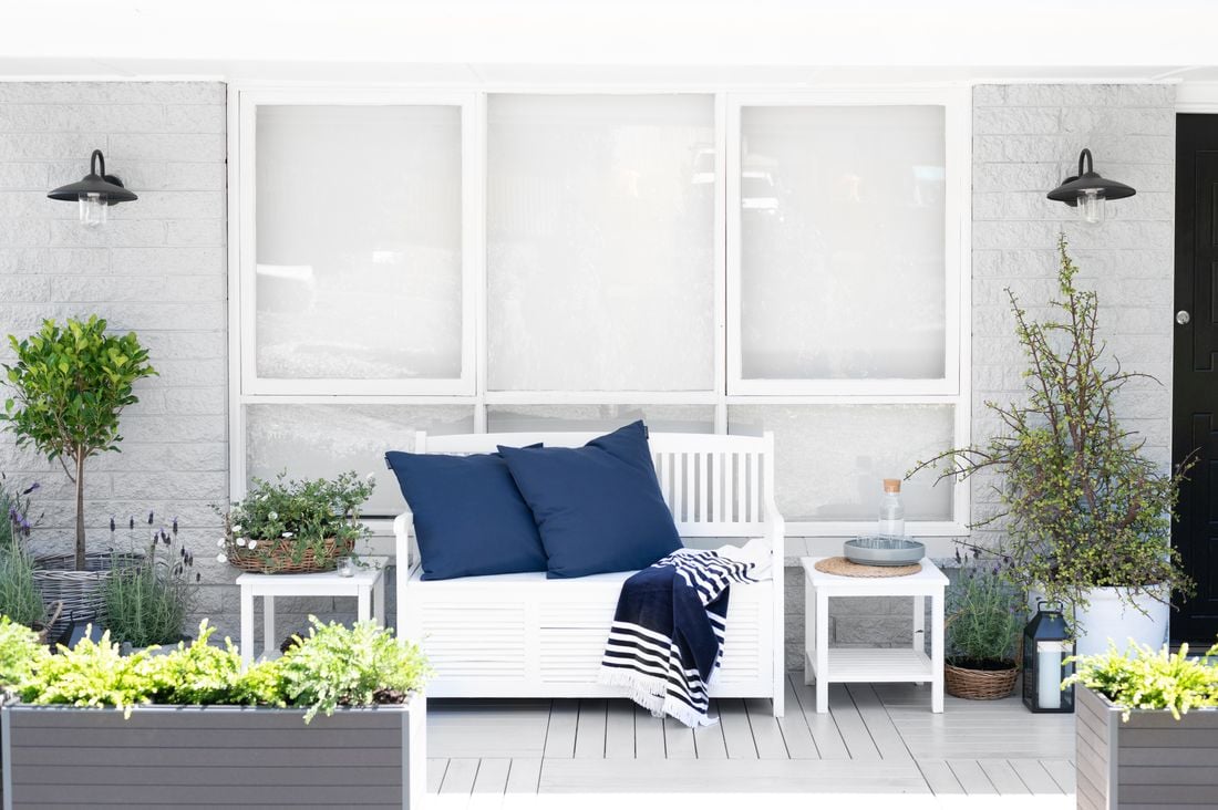 An exterior shot of the freshly painted white timber window frames shows us the end product.