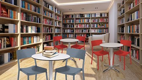 Library with bookshelves and chairs and tables