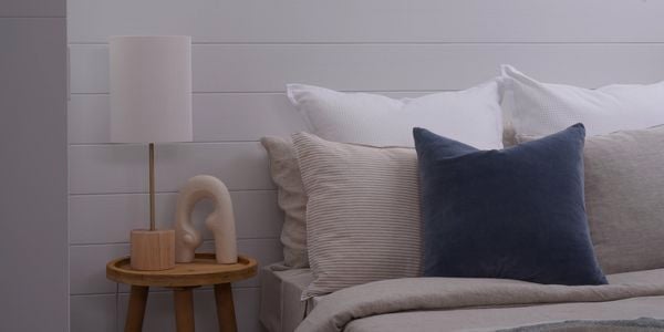 InBuilt image of panels in a bedroom with bed side table and bed in shot