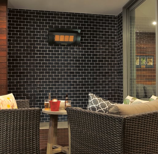 Wood and wicker themed outdoor area with wall mounted heat lamp