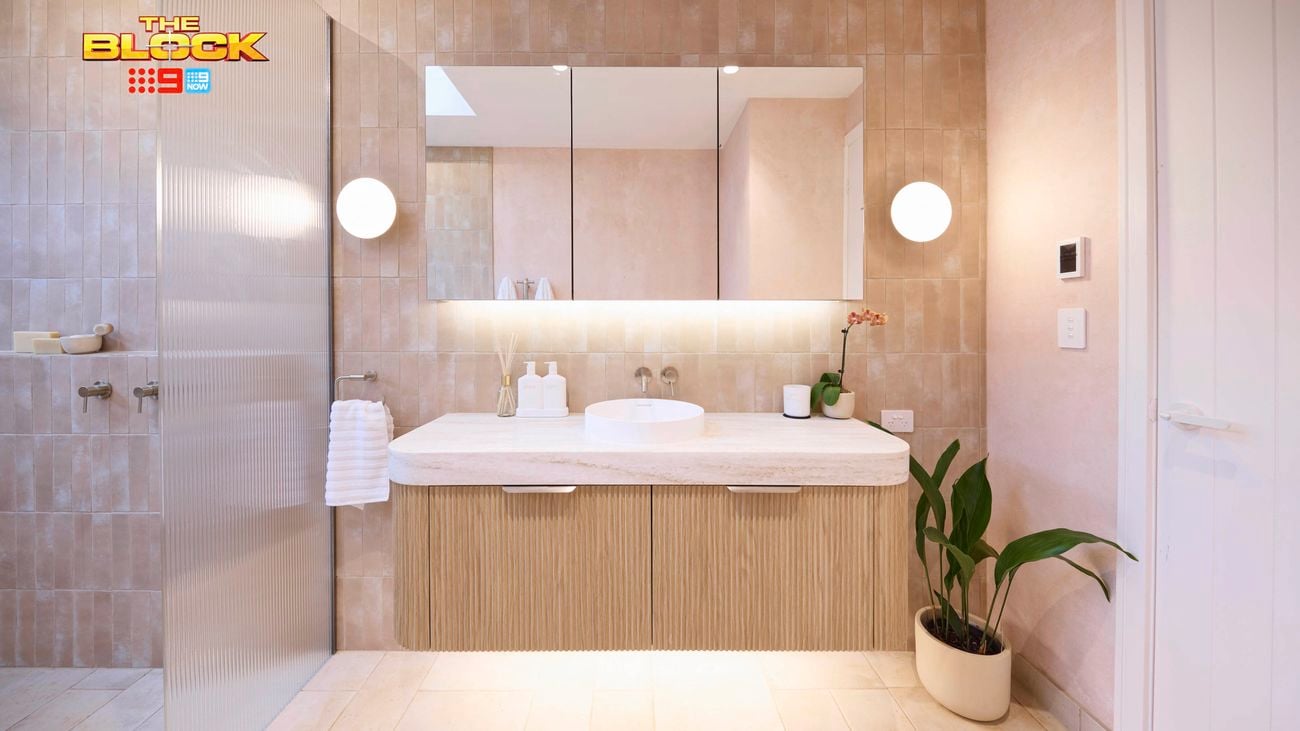 Natural coloured bathroom with shower, vanity and mirrors