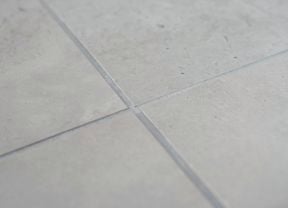 Sealed grout tiled floor with light-colored grout lines 