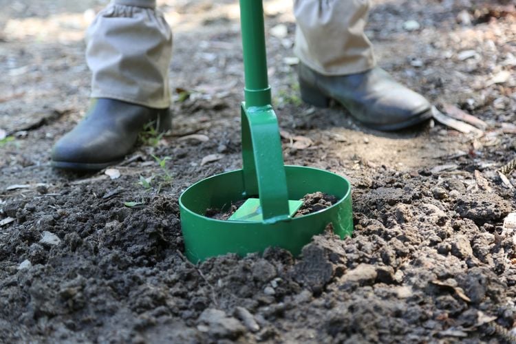 A post hole digger used to dig a hole for a post