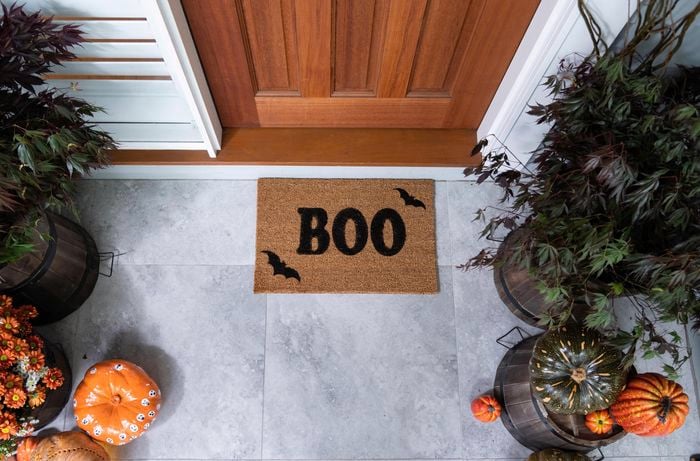 Front door mat with the words Boo stencilled on it