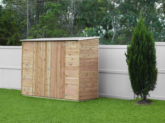 Timber shed with sloping roof and double doors in a garden setting