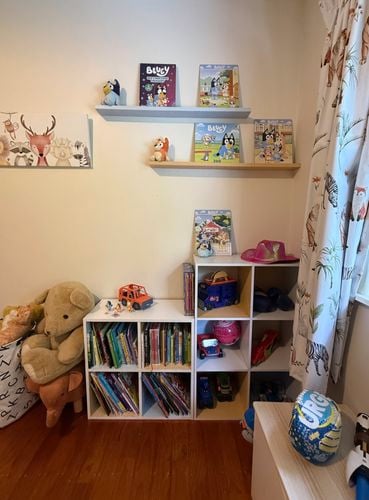 Kids room with Bluey books on a floating bookshelf