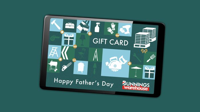 Bunnings Warehouse Father's Day eGift card displayed on a tablet against a teal background. The gift card design features icons of tools, hardware, gardening and home improvement products in a grid pattern, with the text "GIFT CARD" and "Happy Father's Day" and the Bunnings Warehouse logo in the bottom right corner.