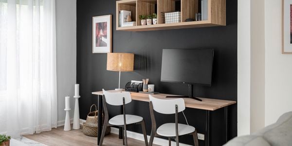 An angled in situ picture of a feature wall behind a study nook