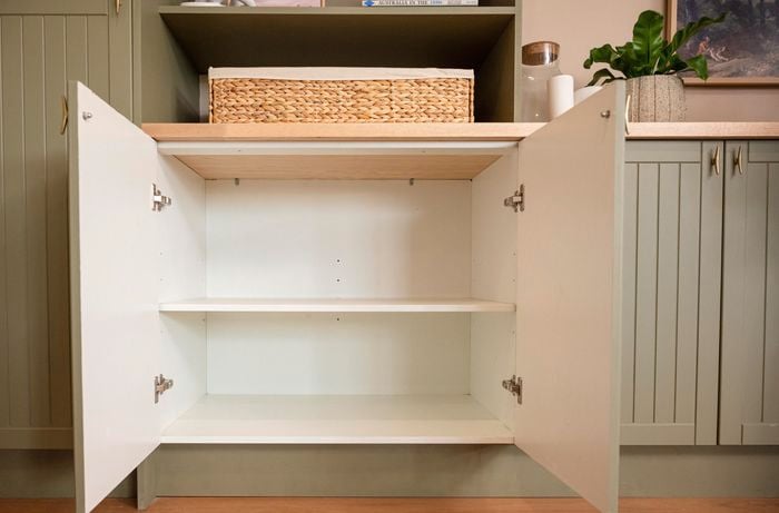Kitchen with cabinet door open