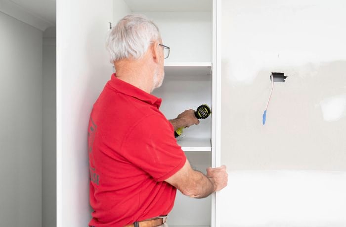 Position and fix the pantry to the wall 