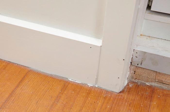 A timber floor with skirting board and architrave