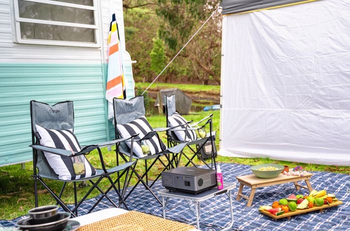 Create an outdoor cinema experience and cosy lounge.