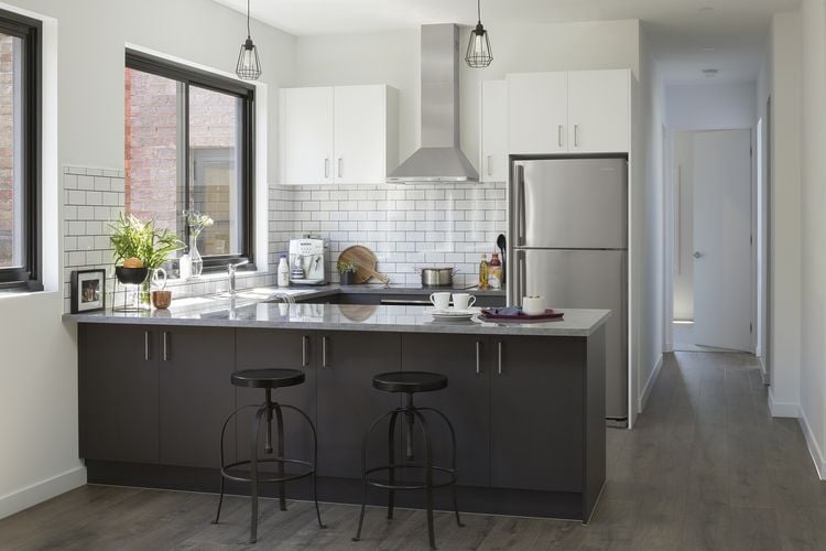 Modern kitchen with marble kitchen bench and stools