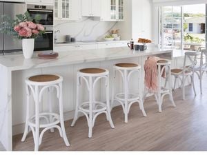 Kitchen with white cabinets and benchtops.