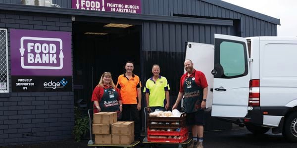 Bunnings Team Members and people out the front of the Albany Food Bank.