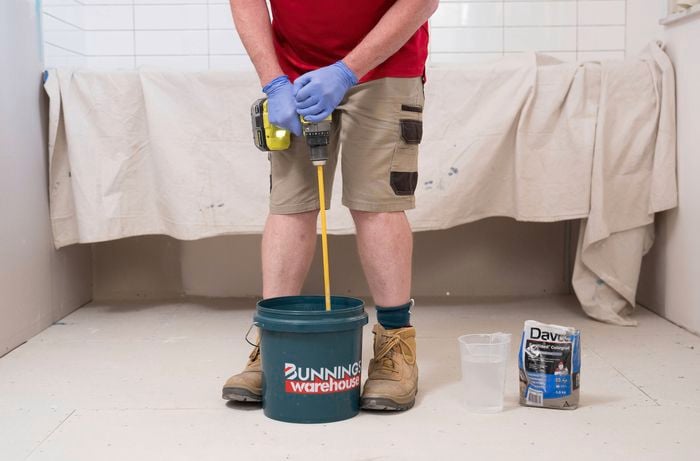 Mix the grout with water in a bucket 