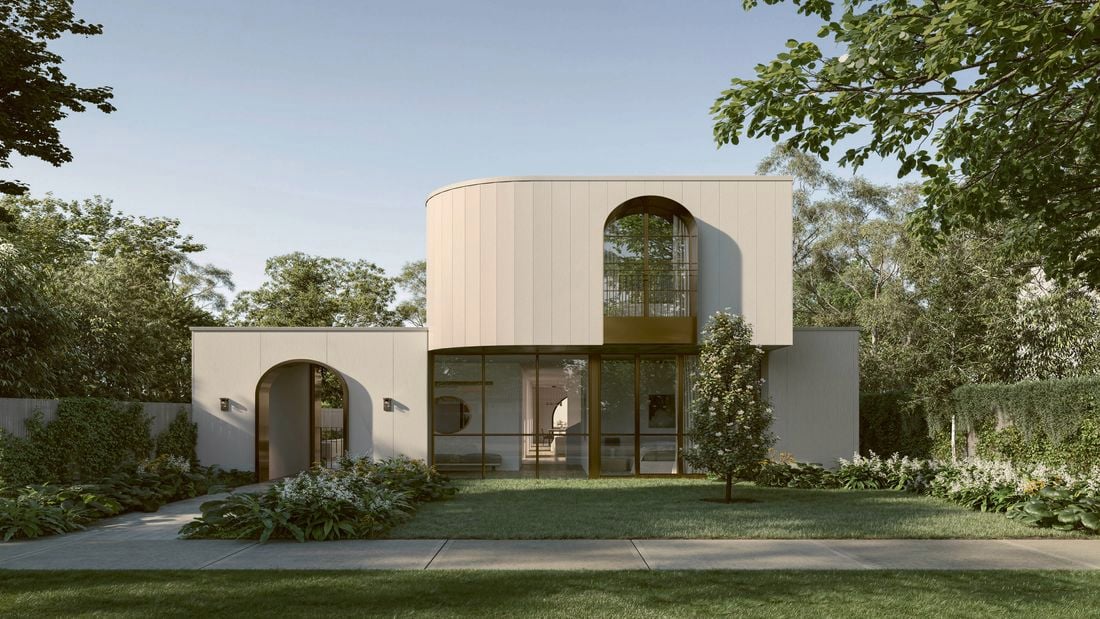 Modern house with curved facade, arched windows, lush garden and lawn.