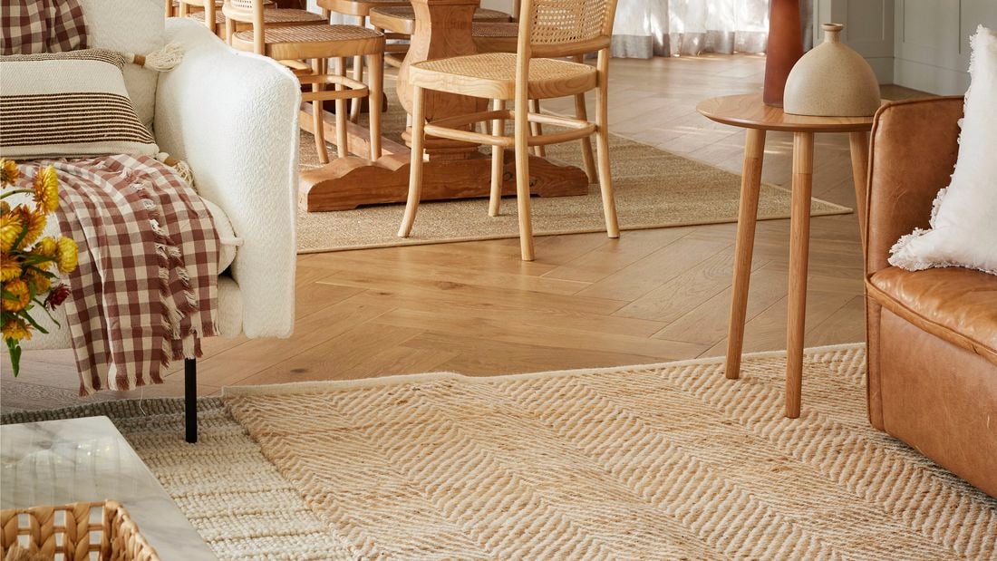 a living room with rugs