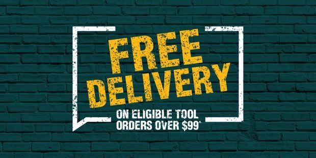 Graphic with the text Free delivery on eligible tool orders over $99^ on a green background