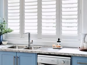 White venetian blind shutters