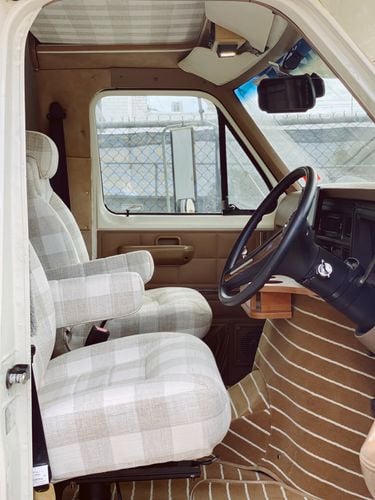 An RV caravan front seat area.