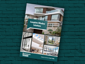 Bunnings Trade Windows Booklet on a green brick background