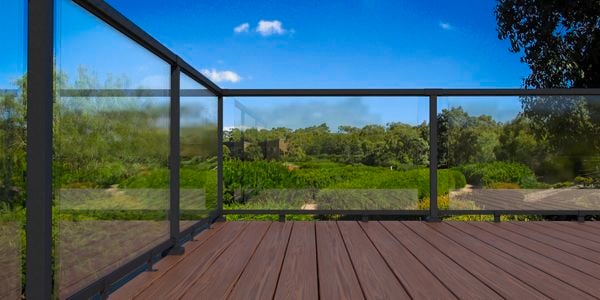 Black balustrade on wooden decking outside.