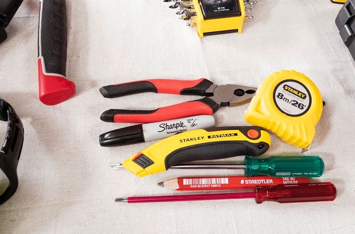 Assorted tools laid out on benchtop.