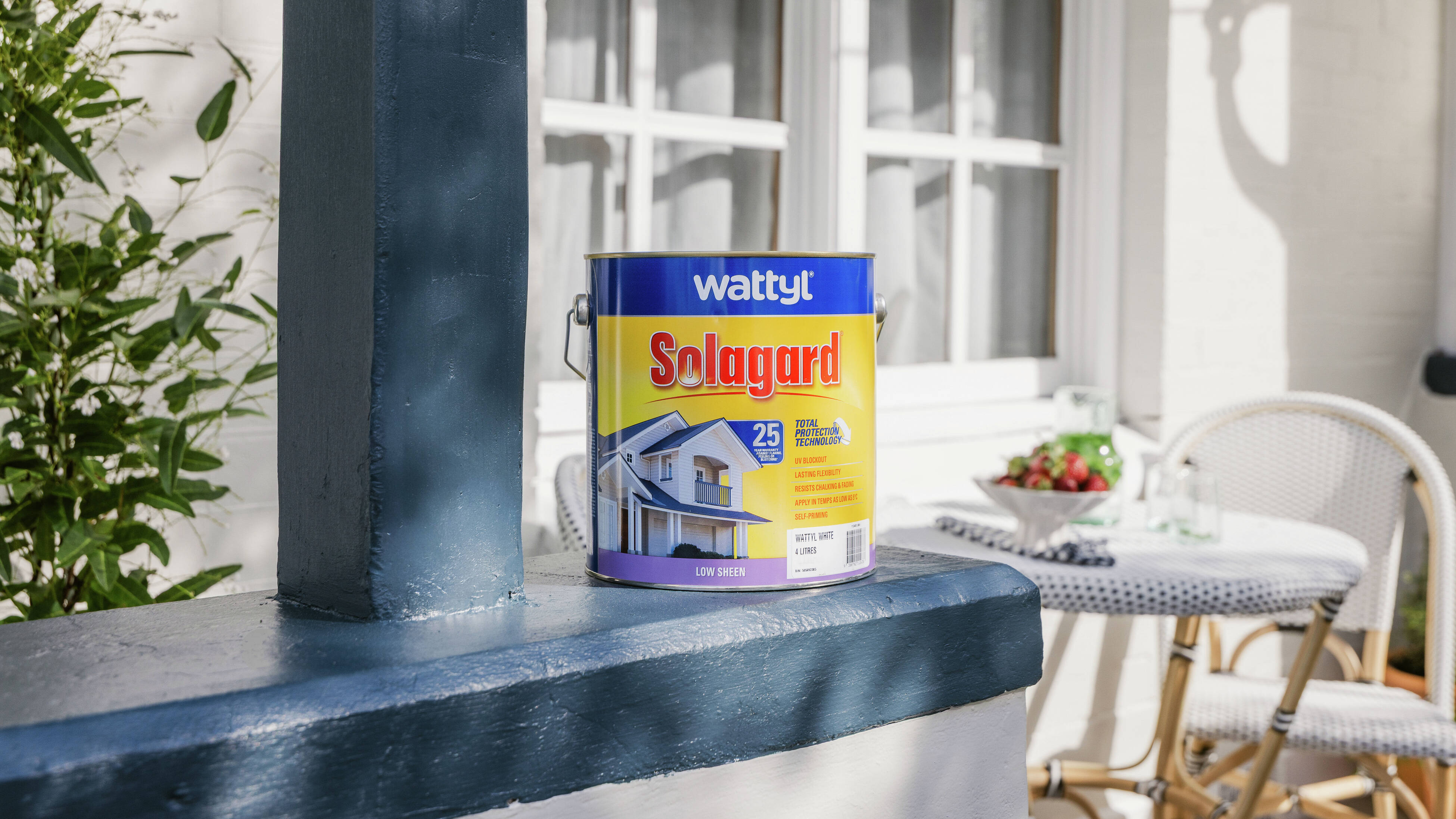 Wattyl Solagard paint tin displayed on a freshly painted heritage veranda.
