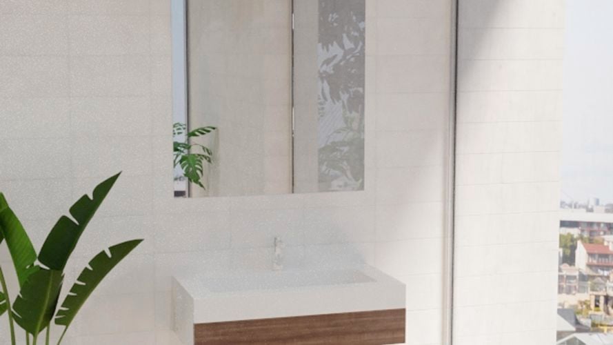 Bathroom with square mirror along with wash basin, plant and white wall tiles.