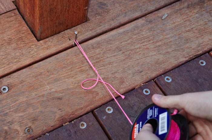 Person setting out string line.