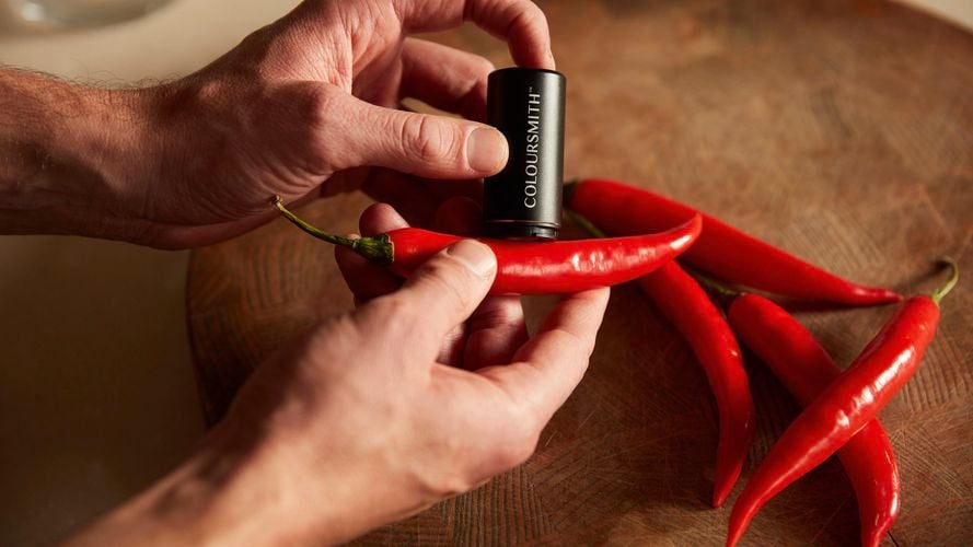 Person uses Coloursmith reader to scan a chilli