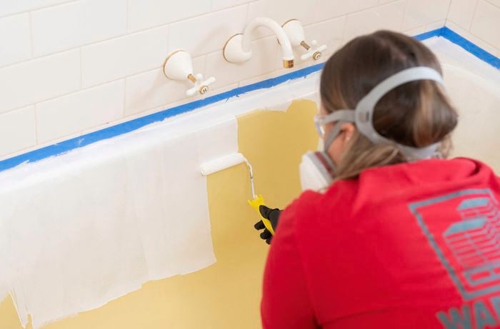 Apply the first coat of paint using a paint roller 